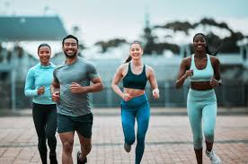 Sculpting Sleek Arms: The Essential Role of Cardio in Toning Without Bulking Up 3 image of people running to incorporate cardio Southampton exercise into their life to help tone arms and body.