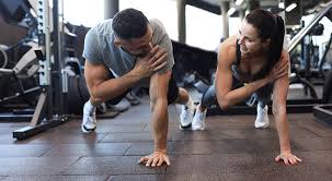 Sculpting Sleek Arms: The Essential Role of Cardio in Toning Without Bulking Up 1 Image of man and woman doing Cardio Southampton to tone their arms.